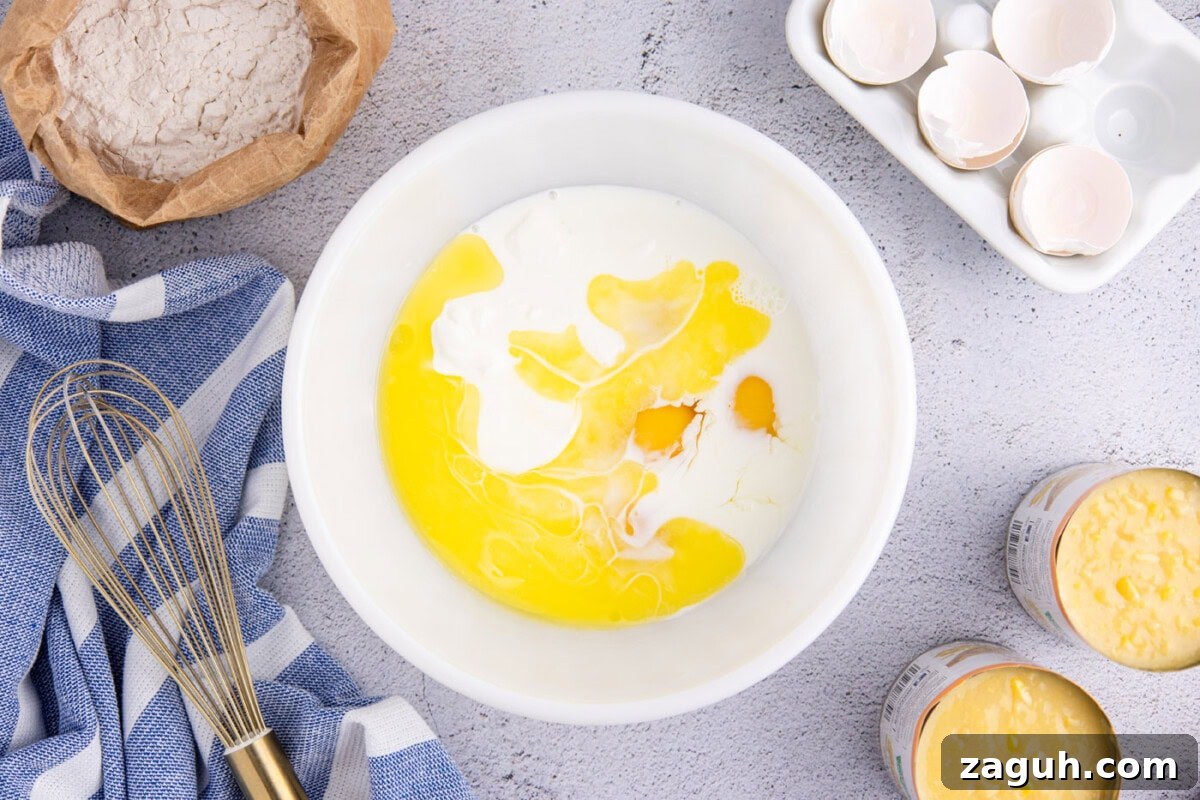 Creamy Southern-Style Corn Pudding Recipe 6 eggs and buttermilk mixture in a bowl