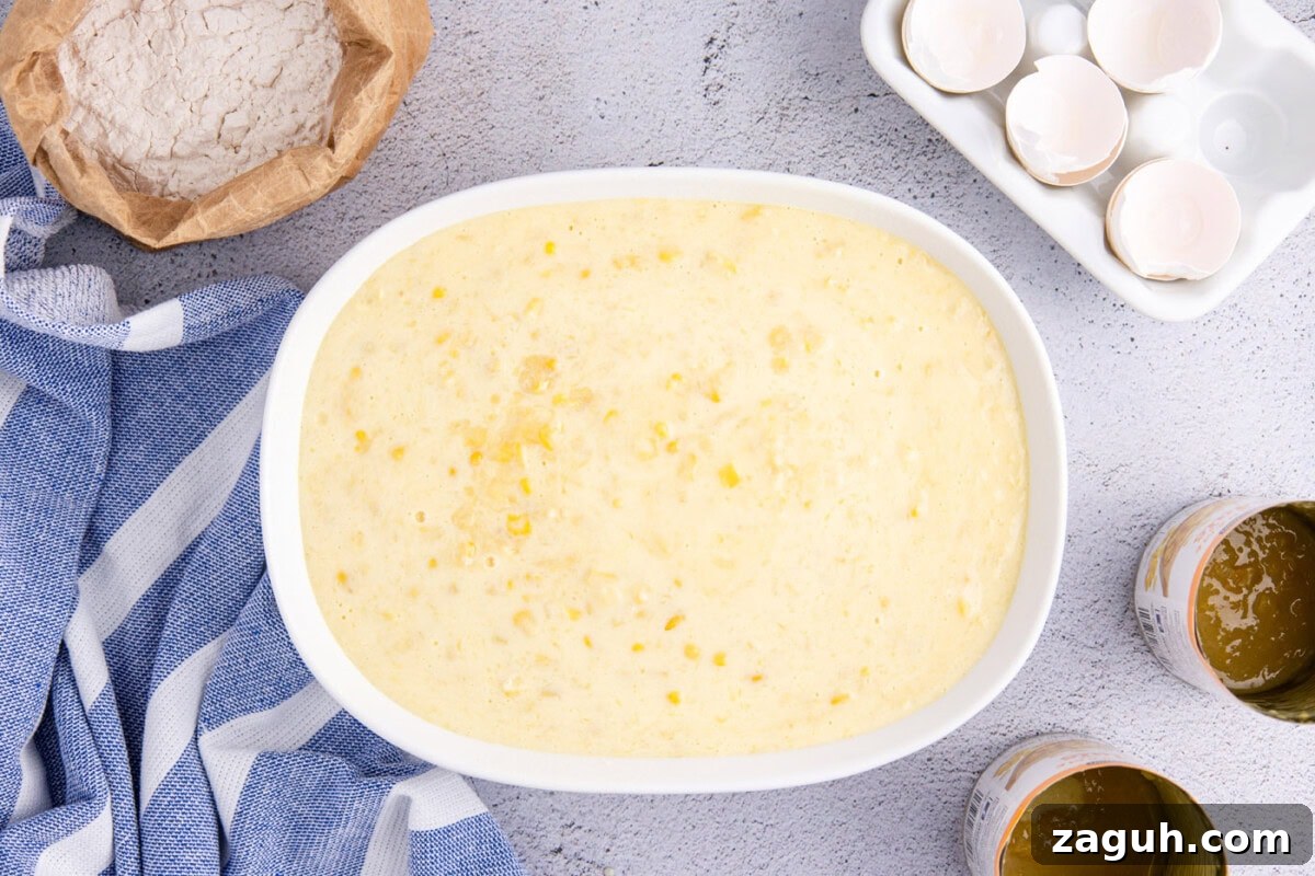Creamy Southern-Style Corn Pudding Recipe 9 overhead shot of corn pudding in an oval baking dish