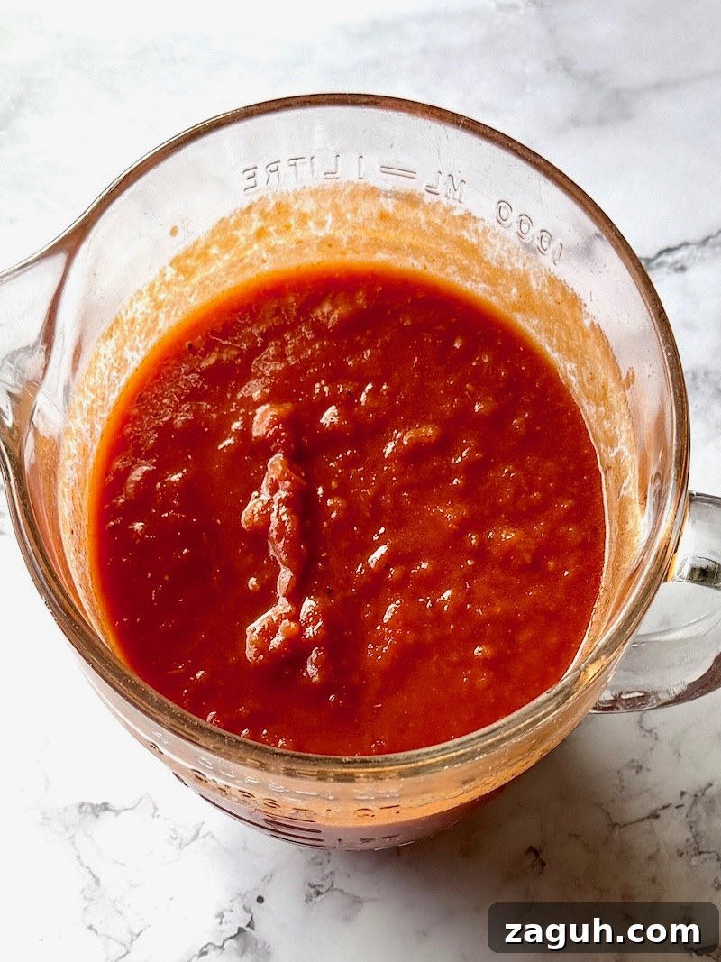 25-Minute Chicken Parmesan Recipe for Busy Family Dinners 4 Pasta sauce combined with balsamic vinegar in a mixing bowl