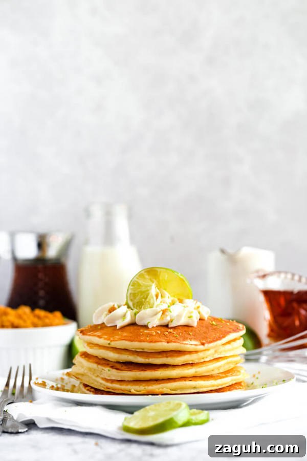 Key Lime Pie Pancakes: soft, fluffy pancakes with bright lime flavor lime pancakes with whipped cream, graham cracker crumbs, lime zest and a lime twist on top