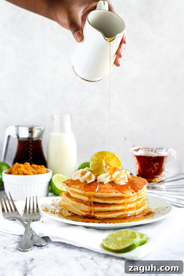 Key Lime Pie Pancakes stack lime pancakes with whipped cream, graham cracker crumbs, lime zest and a lime twist on top