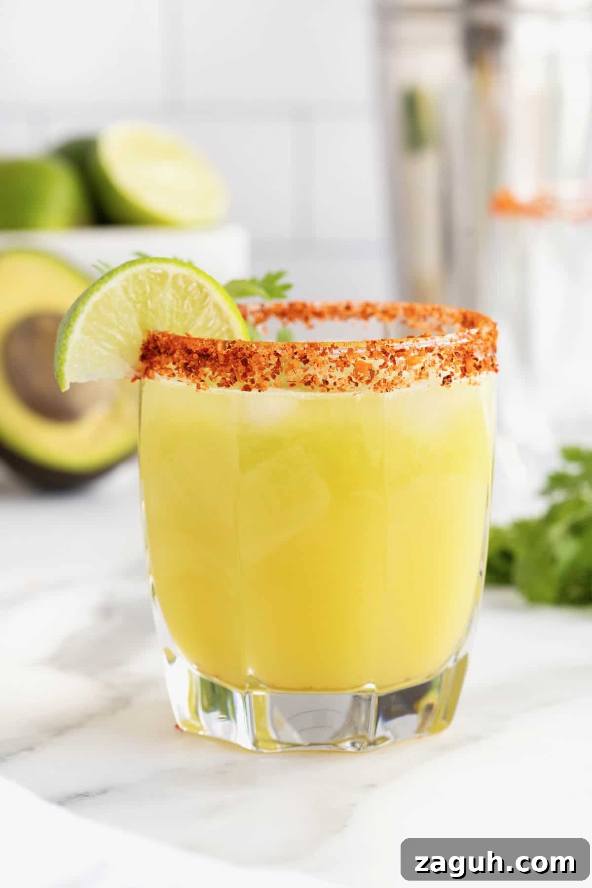 Authentic Mexican Fiesta Recipes for Your Party Menu 18 A short glass filled with margarita and tajin on the rim.
