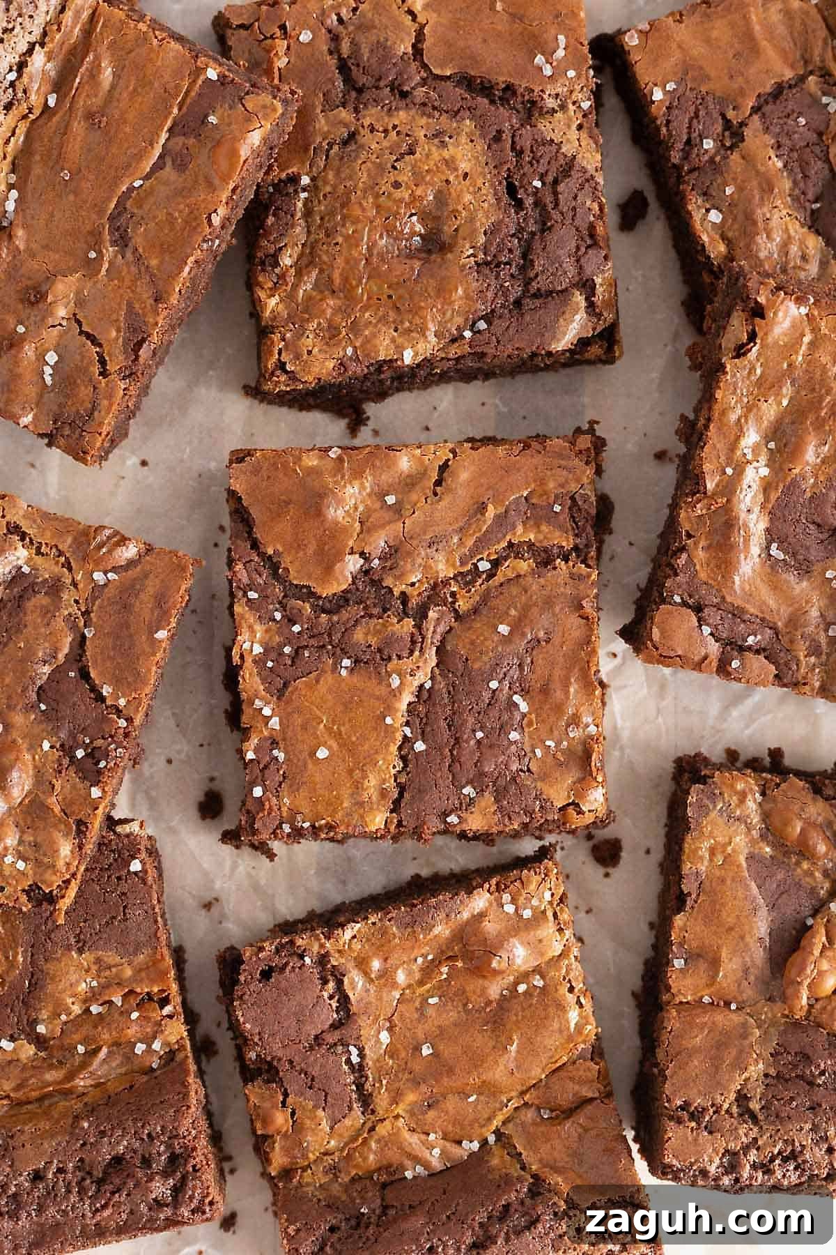 Authentic Mexican Fiesta Recipes for Your Party Menu 32 Salted dulce de leche brownies on a parchment lined surface.
