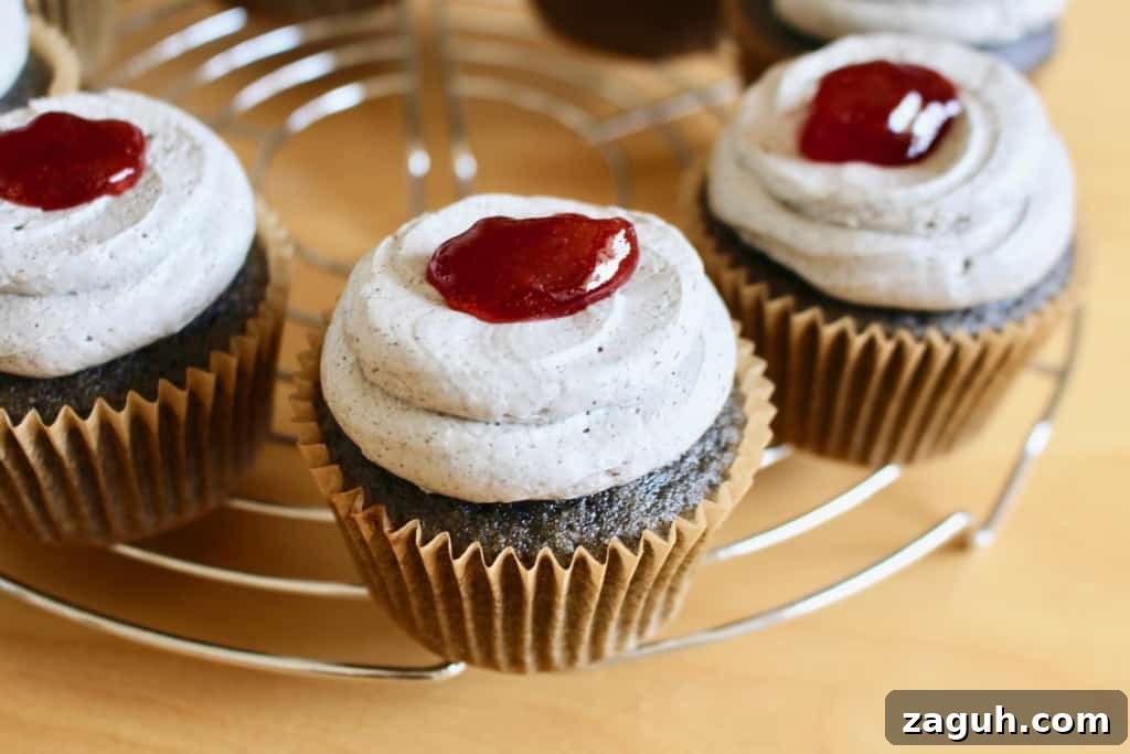 Frosted black cupcakes with a dollop of fake blood