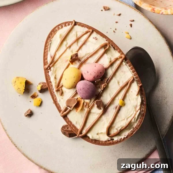 Decadent Chocolate Easter Cupcakes with Spring Decorations 13 Half an Easter egg with a cheesecake filling inside of its hollow, with mini eggs and melted chocolate on top.