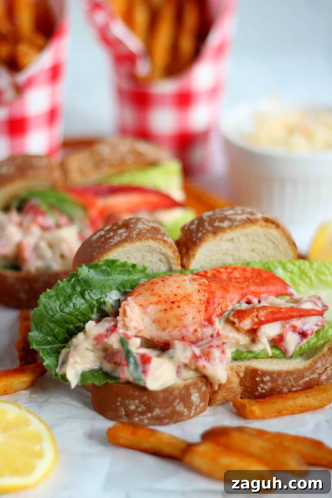 Classic New England Lobster Rolls: Authentic Recipe & Tips 3 close up of lobster mixture in hot dog bun