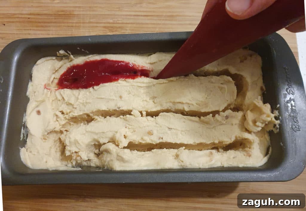 Peanut Butter & Jelly Ice Cream Recipe: Creamy PB&J Frozen Treat 12 Piping jelly into ice cream