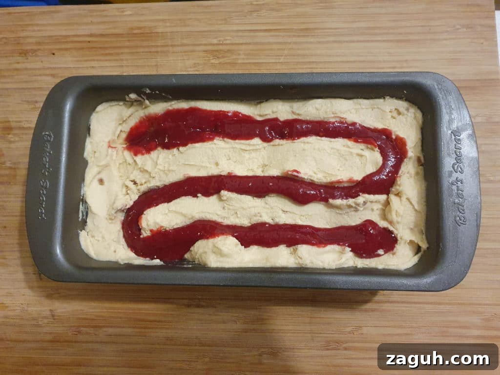 Peanut Butter & Jelly Ice Cream Recipe: Creamy PB&J Frozen Treat 13 Ice cream with piped jelly