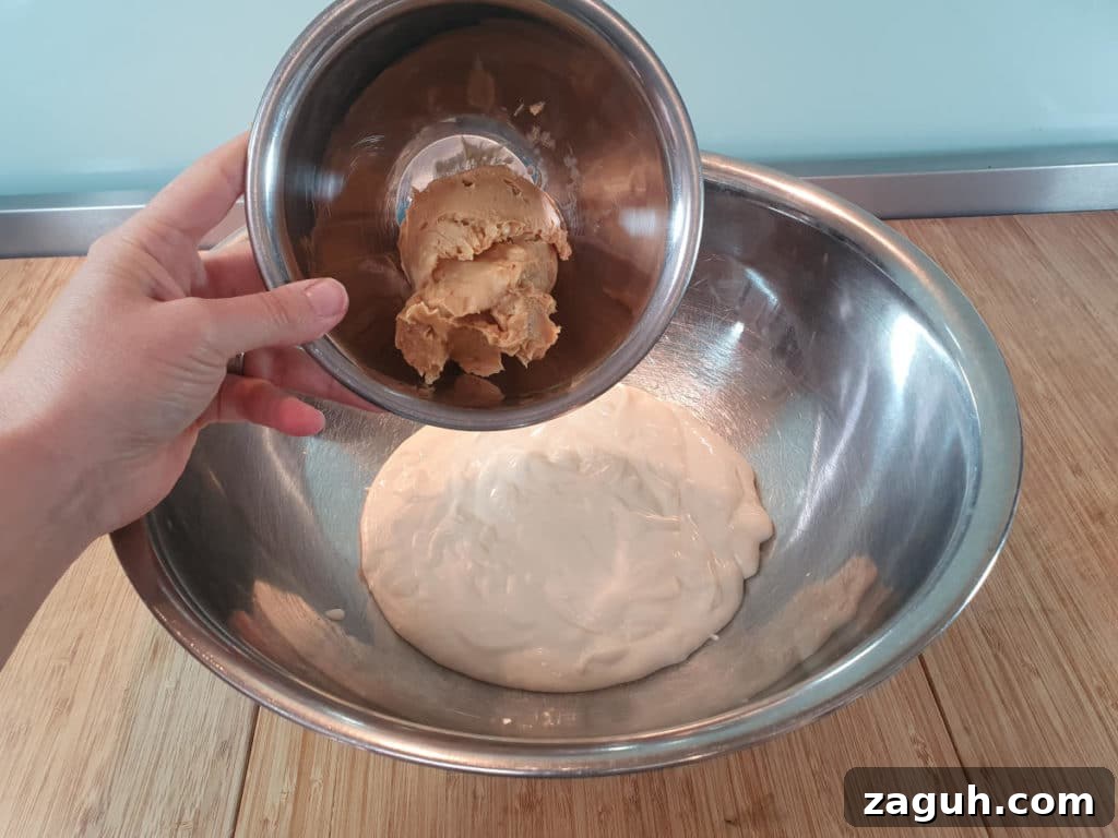 Peanut Butter & Jelly Ice Cream Recipe: Creamy PB&J Frozen Treat 5 Adding peanut butter to bowl