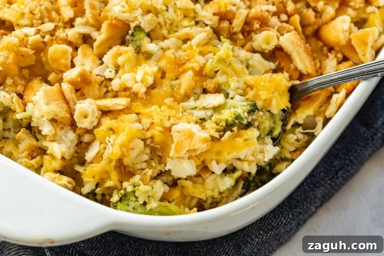 Simple Chicken, Broccoli and Rice Casserole Recipe 2 a white casserole dish full of chicken broccoli rice casserole topped with a golden ritz cracker topping