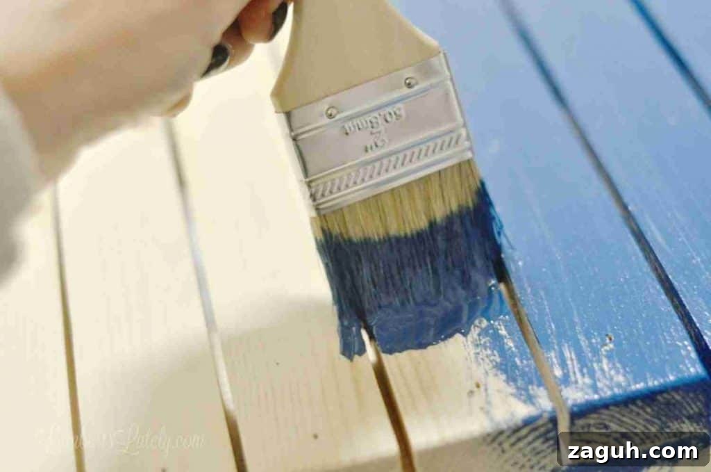 DIY Console Table Plans: Step-by-Step Build Guide and Dimensions 14 painting slats of a table blue.