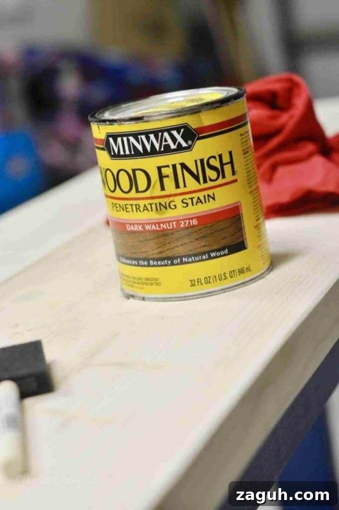 DIY Console Table Plans: Step-by-Step Build Guide and Dimensions 15 can of stain and brush on a wood table before staining.