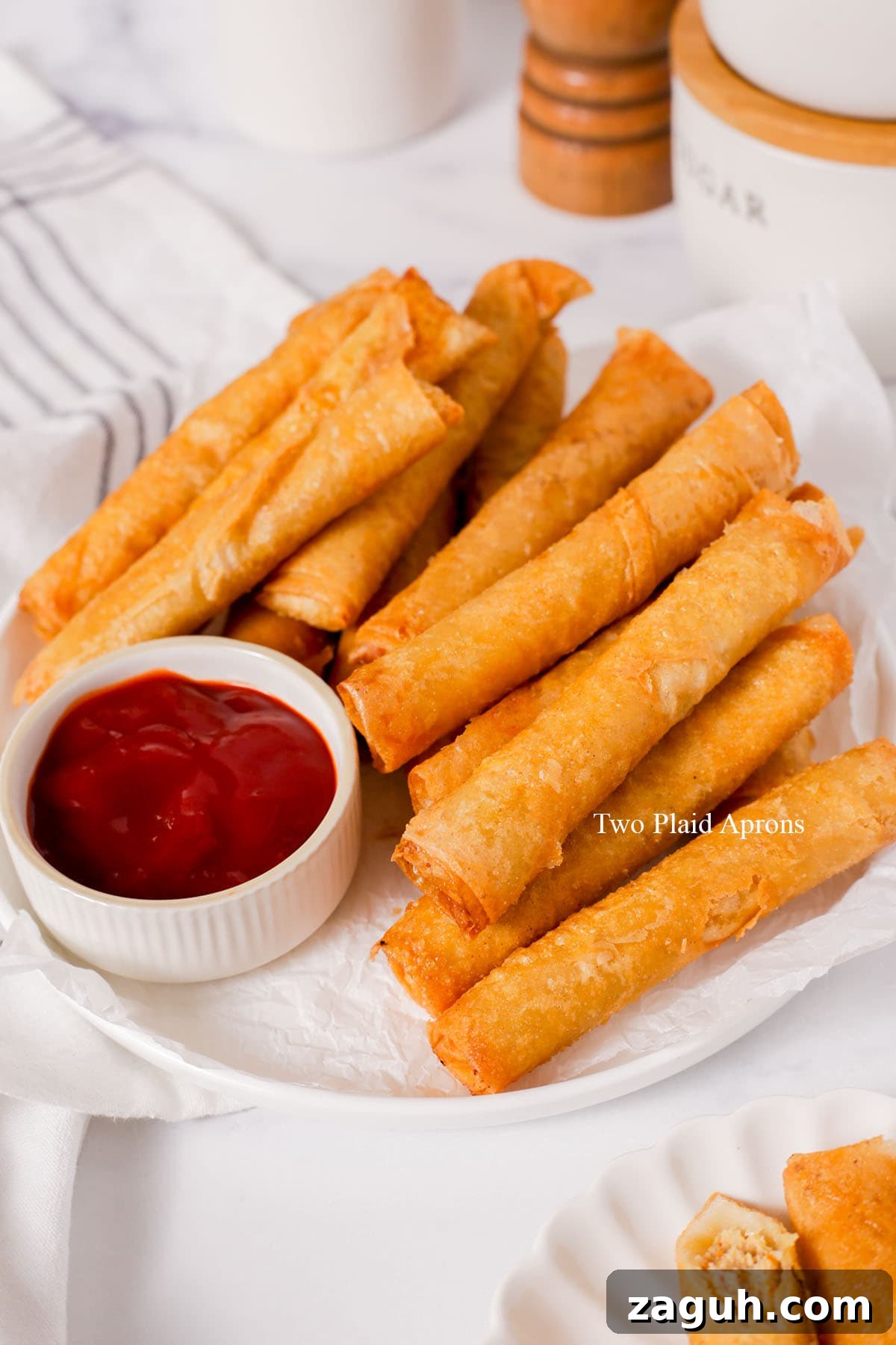 Filipino Lumpia: Classic Crispy Spring Rolls Recipe 19 Lumpia fried and on the plate.
