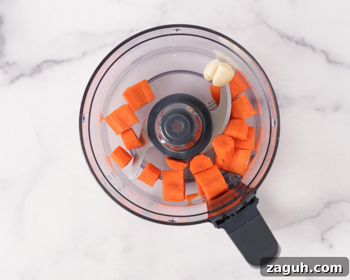 Filipino Lumpia: Classic Crispy Spring Rolls Recipe 8 Placing carrots and garlic in the blender.