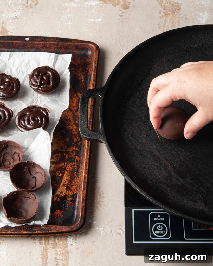 Baileys Hot Chocolate Bombs Recipe: Homemade Boozy Cocoa Surprises 12 Using a hot skillet to melt the edges of a chocolate half sphere.