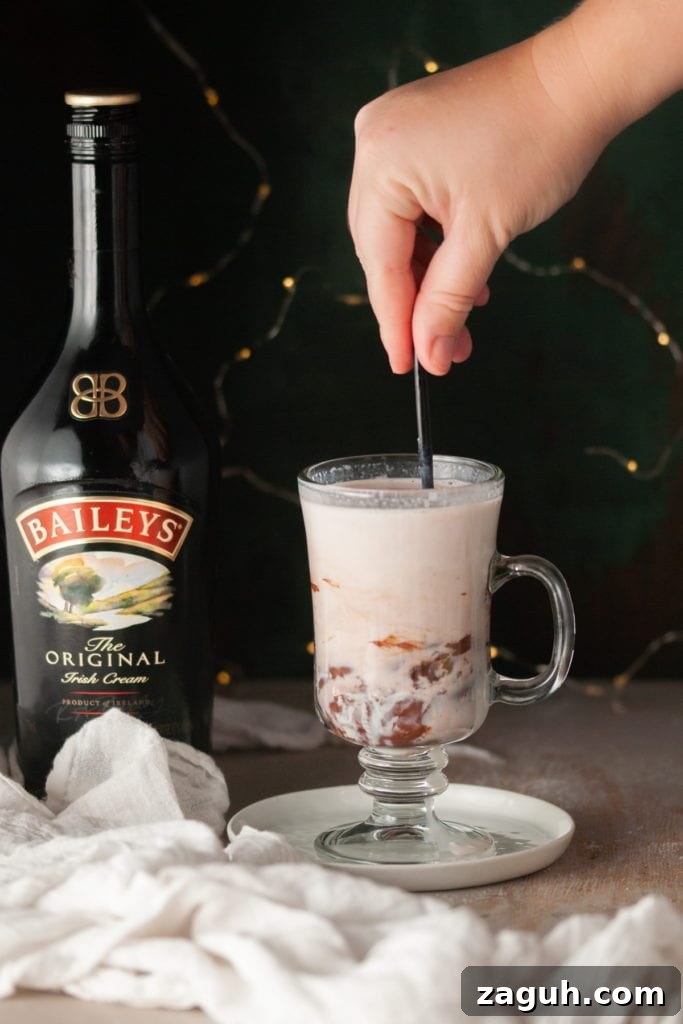Baileys Hot Chocolate Bombs Recipe: Homemade Boozy Cocoa Surprises 17 Stirring Hot Milk with Baileys Hot Chocolate Bombs