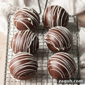 Baileys Hot Chocolate Bombs Recipe: Homemade Boozy Cocoa Surprises 19 6 Baileys Hot Chocolate Bombs on a silver cooling rack