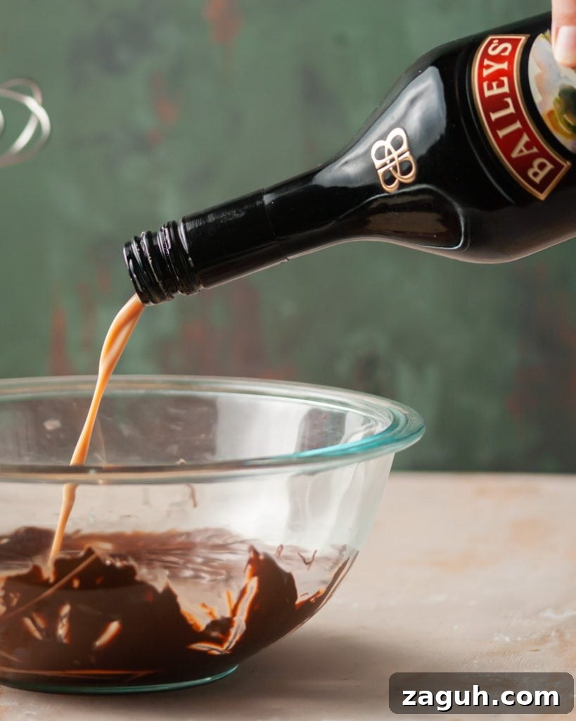 Baileys Hot Chocolate Bombs Recipe: Homemade Boozy Cocoa Surprises 6 Adding Bailey's Irish Cream to hot chocolate mixture