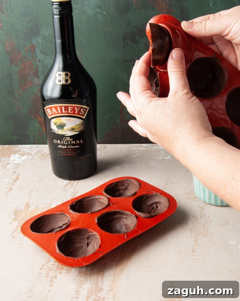 Baileys Hot Chocolate Bombs Recipe: Homemade Boozy Cocoa Surprises 10 removing chocolate half spheres from mold