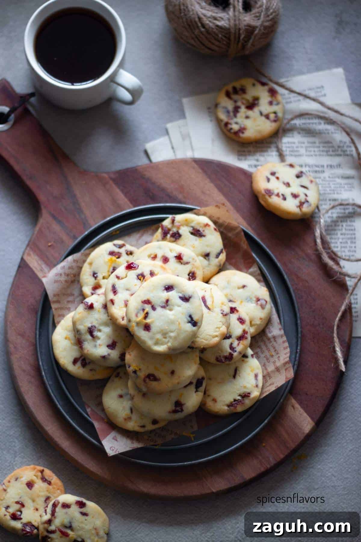 Cranberry Orange Shortbread Cookies (Egg-Free) 2 stack of cranberry orange shortbread cookies placed on a plate