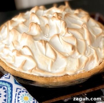 No-Bake Coconut Cream Pie Recipe — Silky Coconut Custard Pie 7 Meringue on pie.