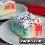 red white and blue poke cake on white plate