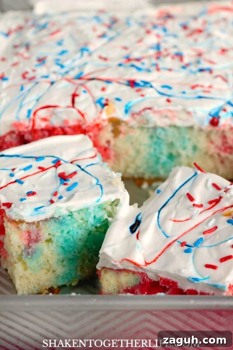 Red and blue POP inside this easy patriotic dessert - it couldn't be easier to make this Red, White & Blue Poke Cake!