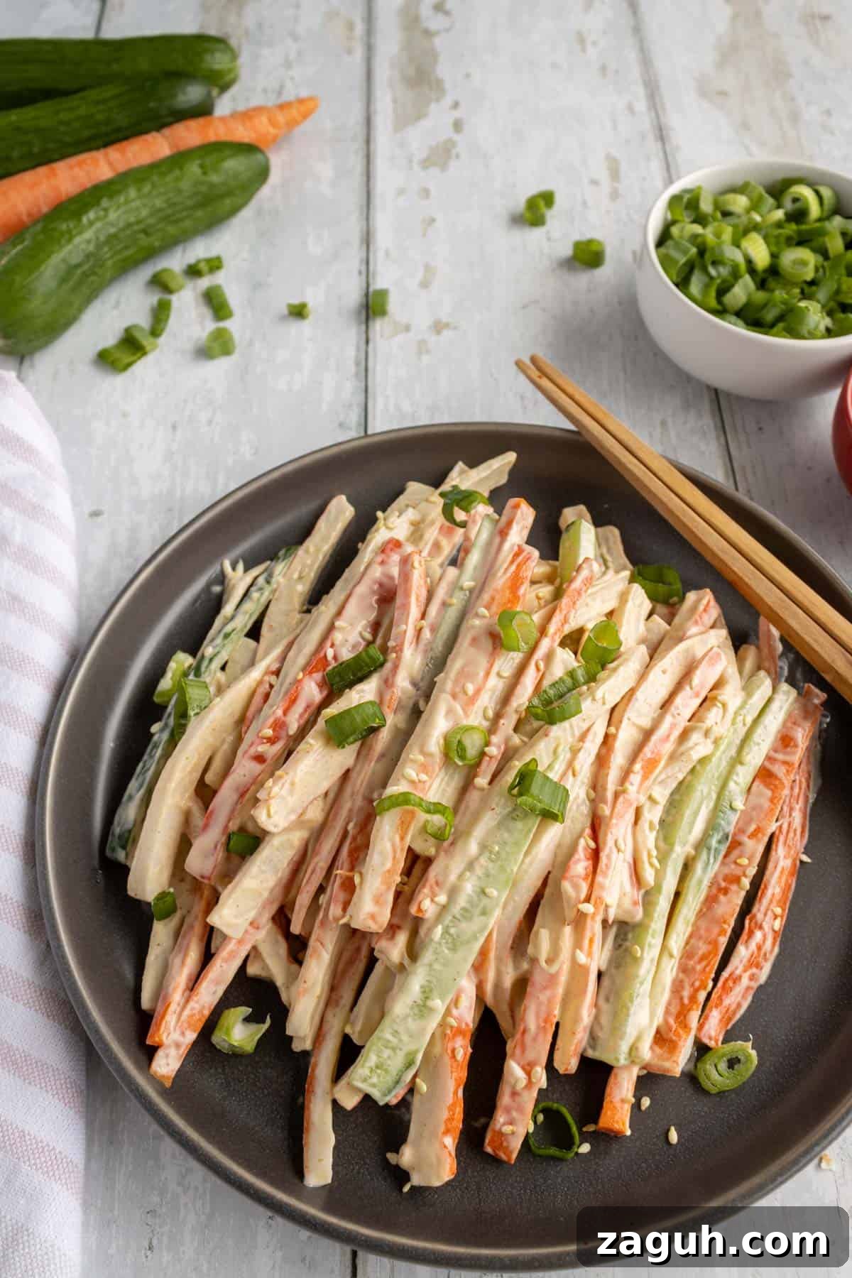 Kani Salad Recipe: Japanese Crab Stick Salad with Sesame Dressing 2 crab sticks, carrots and cucumbers in a mayo dressing.