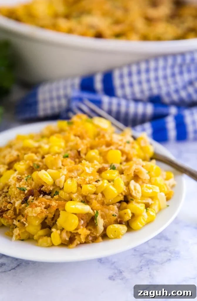 Creamy Corn Pudding Casserole Recipe for Comforting Sides 8 A plate of corn pudding with a fork on it.