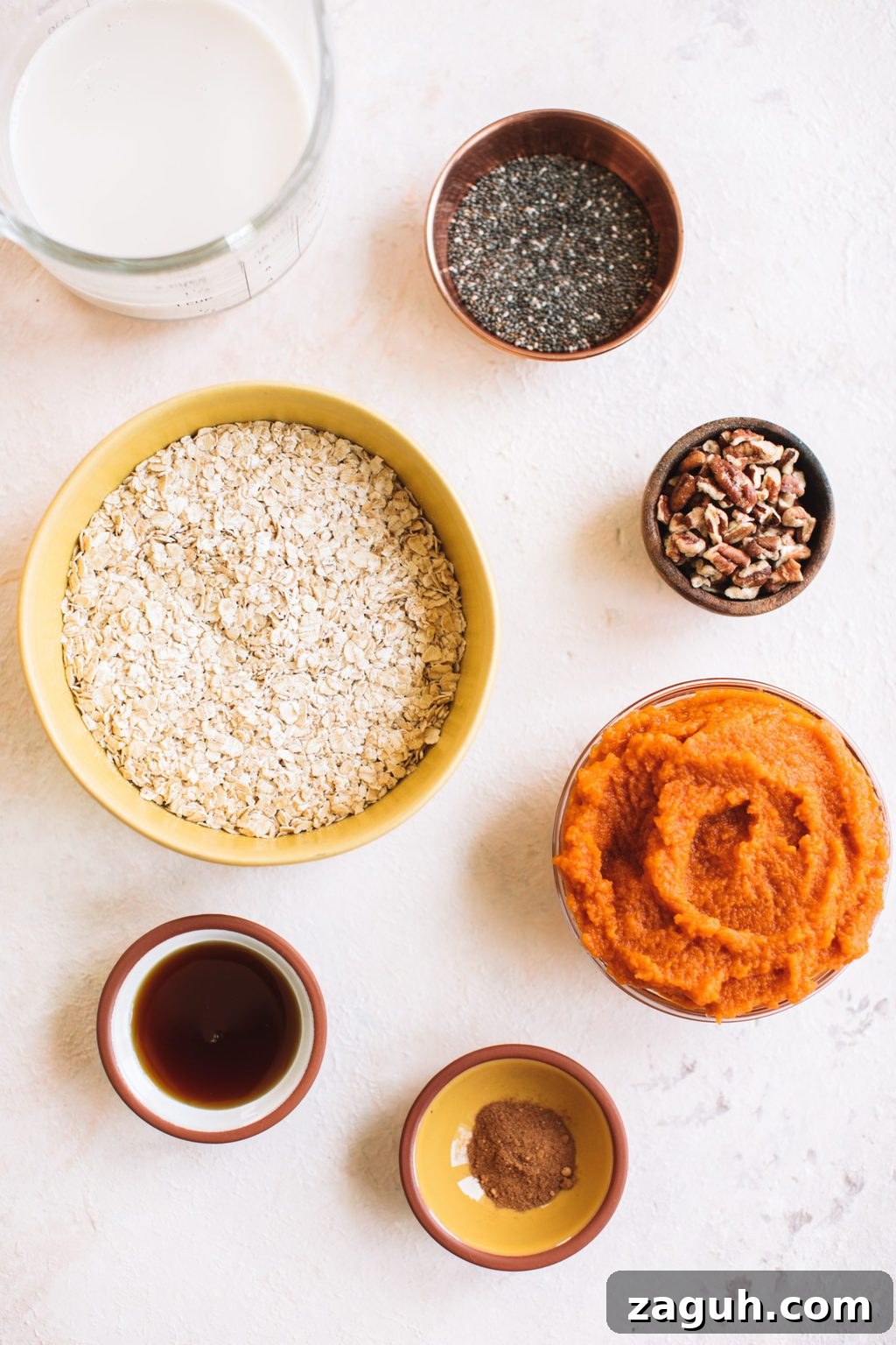 Creamy Pumpkin Overnight Oats Recipe for Fall Breakfast 4 rolled oats, almond milk, chia seeds, pecans, pumpkin puree, pumpkin pie spice, maple syrup
