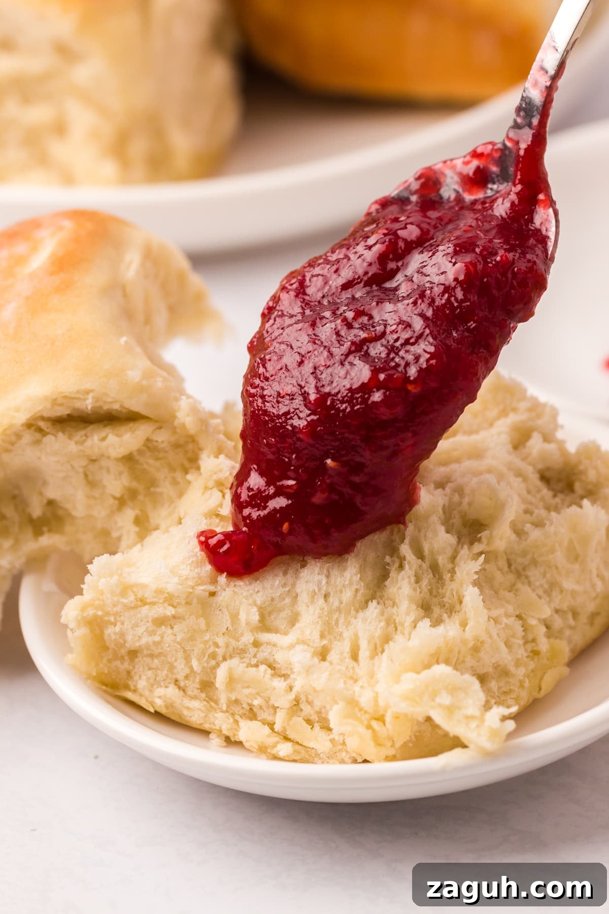 Sourdough roll with jam sourdough roll with jam spooned on