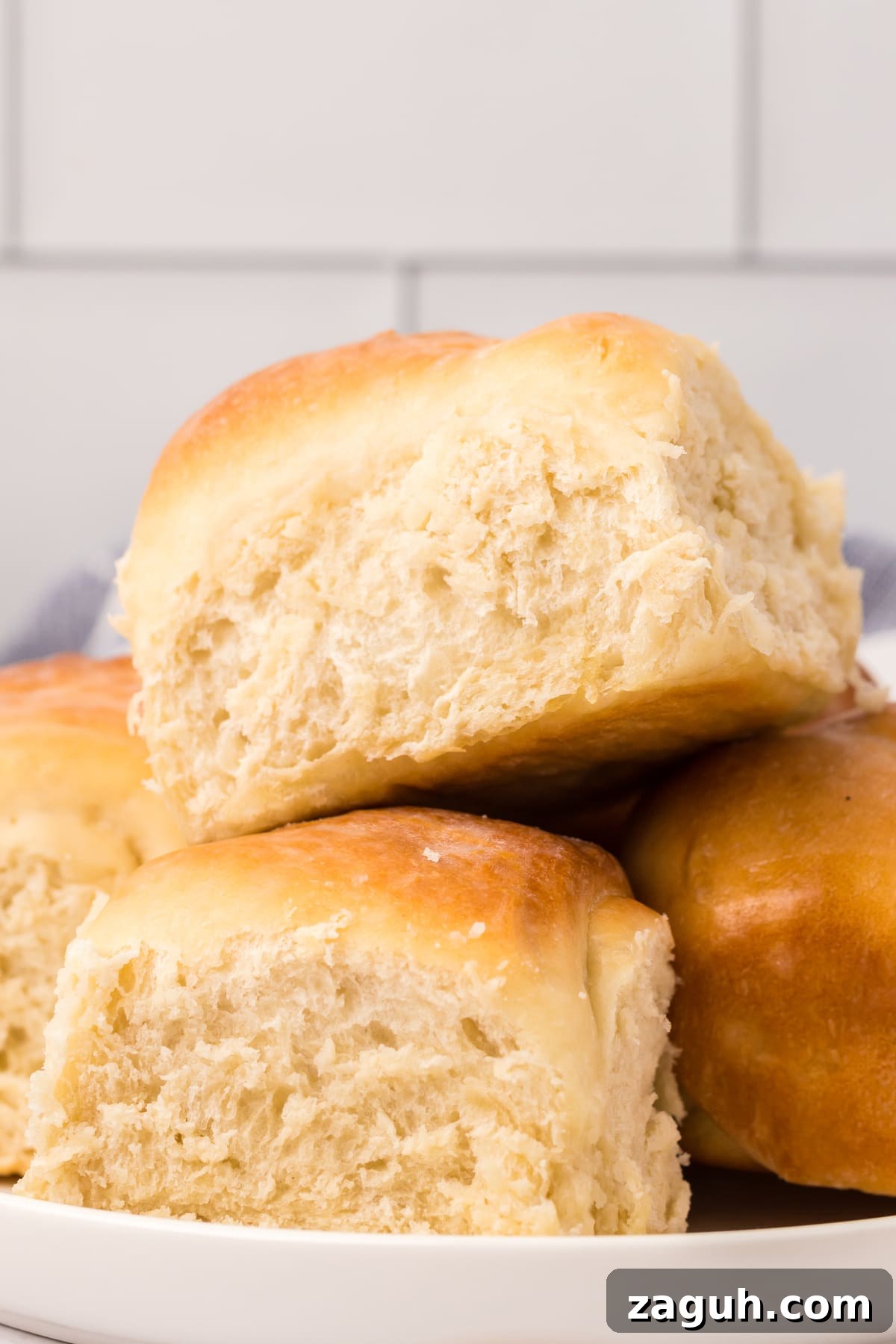 Stacked sourdough rolls sourdough rolls stacked on white plate
