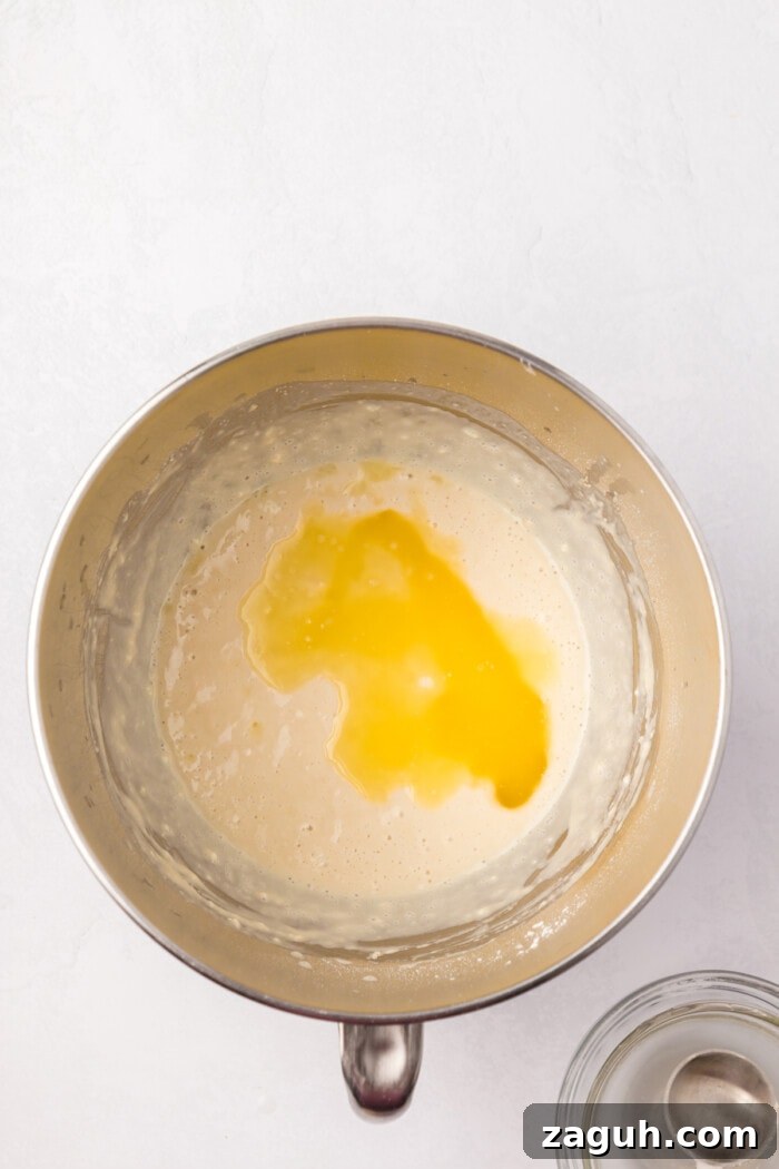 Add butter and salt sourdough starter with melted butter in bowl