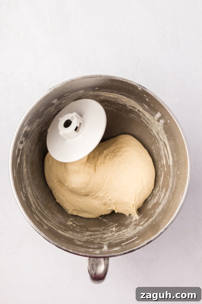 Sticky dough sourdough rolls mixed in bowl