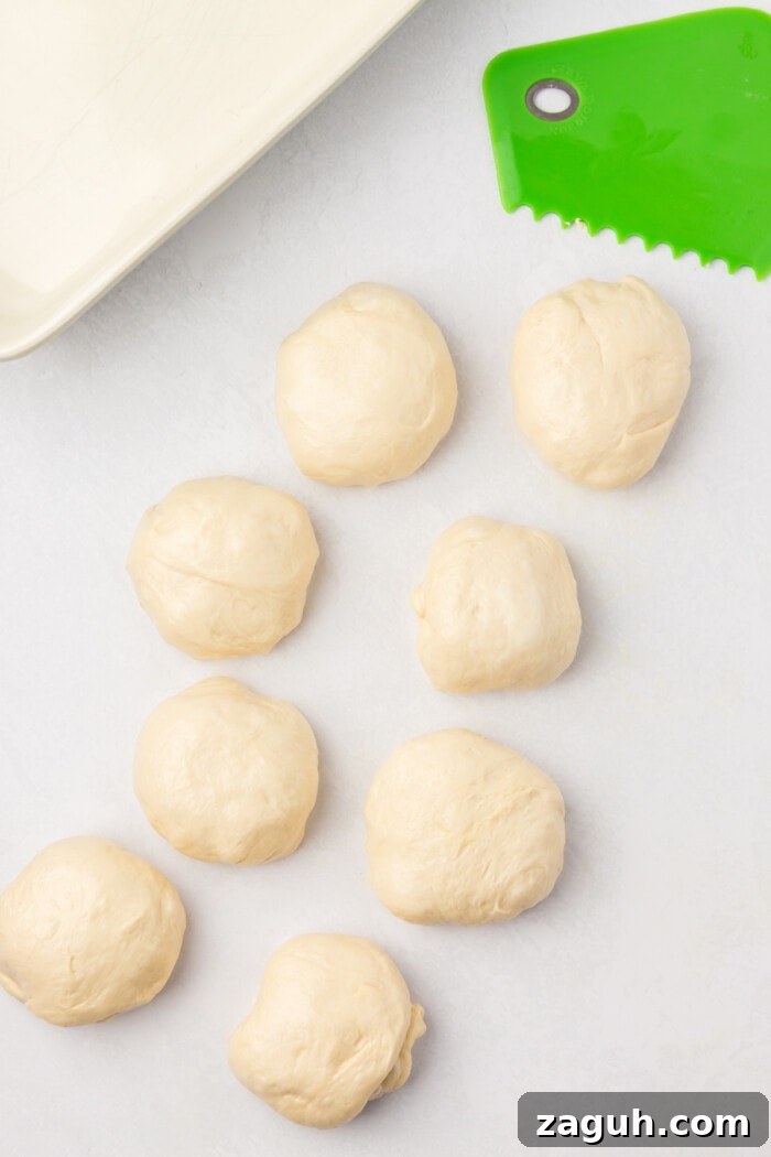 Portioned dough sourdough rolls cut ready to be baked
