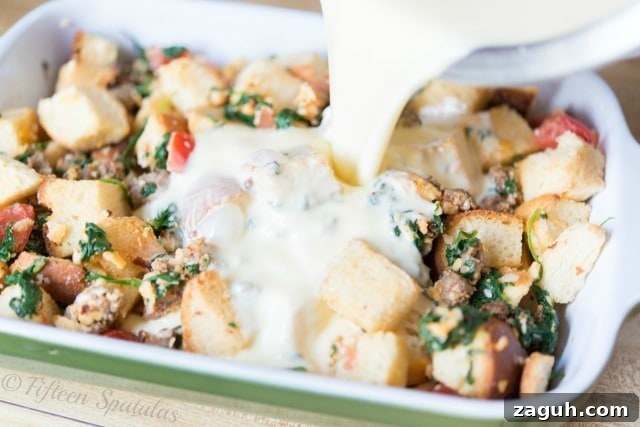 Sausage Spinach Brunch Casserole Recipe Pouring the Custard Over the Bread Cubes in Dish