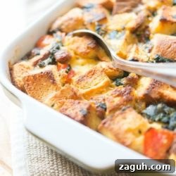Savory Sausage Breakfast Casserole Recipe for Brunch 5 Sausage Breakfast Casserole In a Green Dish with Spoon
