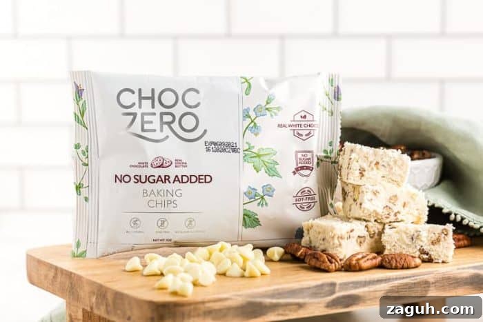 Keto White Chocolate Pecan Fudge — 2g Net Carbs Per Serving 3 bag of choczero white chocolate chips next to keto fudge on a table