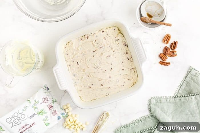 Keto White Chocolate Pecan Fudge — 2g Net Carbs Per Serving 6 overhead view of pan containing sugar free white chocolate fudge