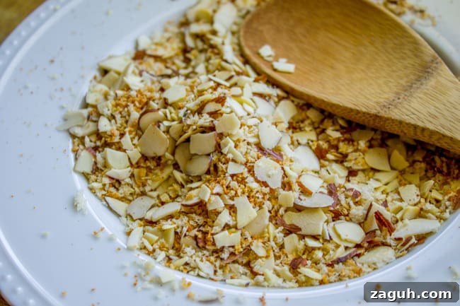 Make-Ahead Garlic Green Beans with Almonds and Crispy Breadcrumbs 9 toasting almonds and breadcrumbs for green beans.