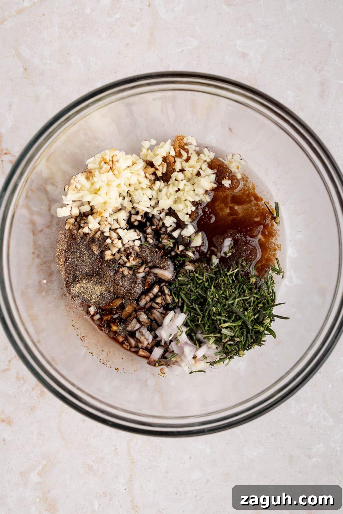 Balsamic-Glazed Oven-Baked Lamb Chops for Weeknight Dinner 3 All of the marinade ingredients in a glass bowl on a countertop.