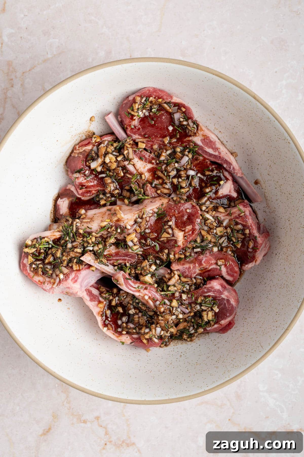 Balsamic-Glazed Oven-Baked Lamb Chops for Weeknight Dinner 4 The lamb chops marinating in the bowl covered in the marinade.