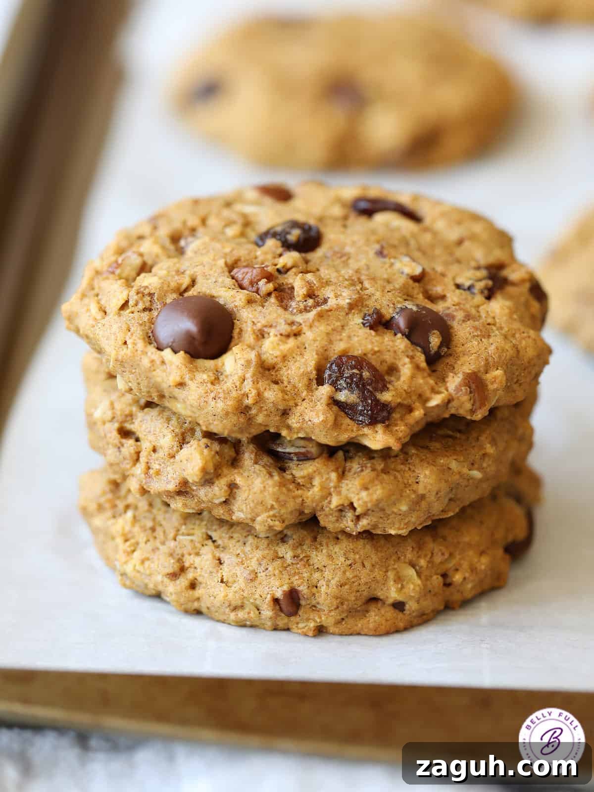 Protein-Packed Breakfast Cookies for Busy Mornings 4 Stack of 3 large cookies on parchment paper
