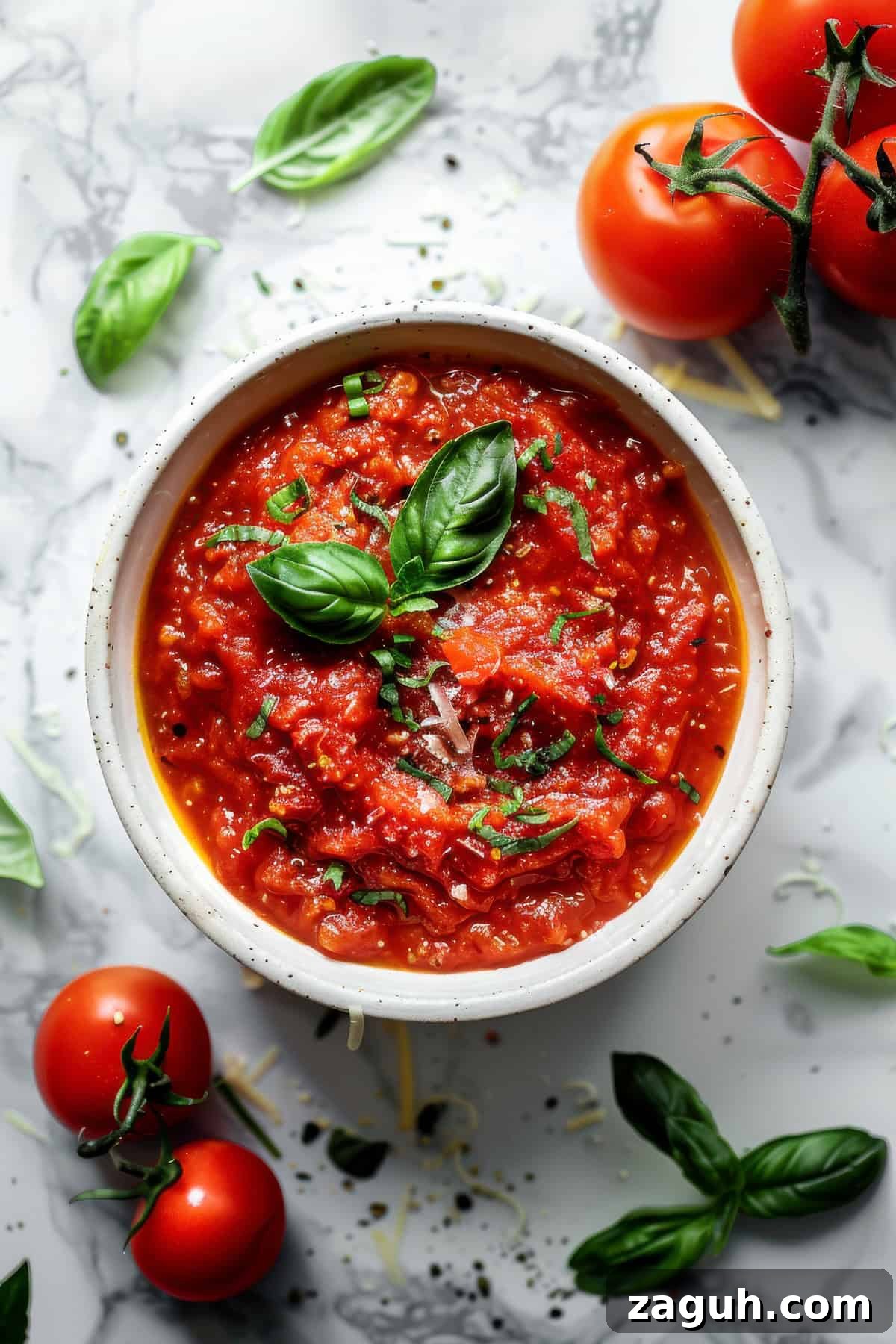 Authentic Pomodoro Sauce Recipe for Fresh Homemade Pasta 2 Pomodoro sauce in a white bowl with basil.