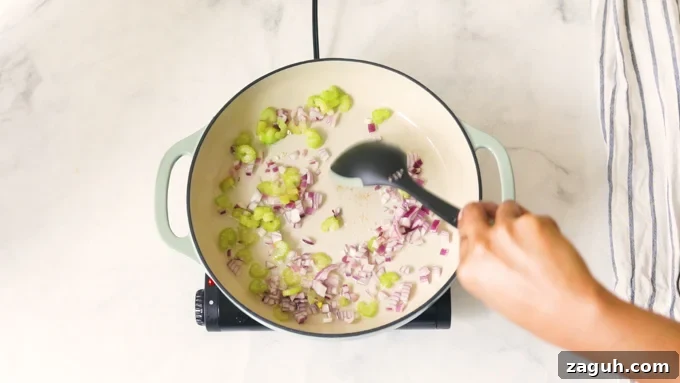 Creamy Tomato Bisque Recipe: Smooth, Rich, and Quick to Make 6 Sauteeing onions and celery in a pot