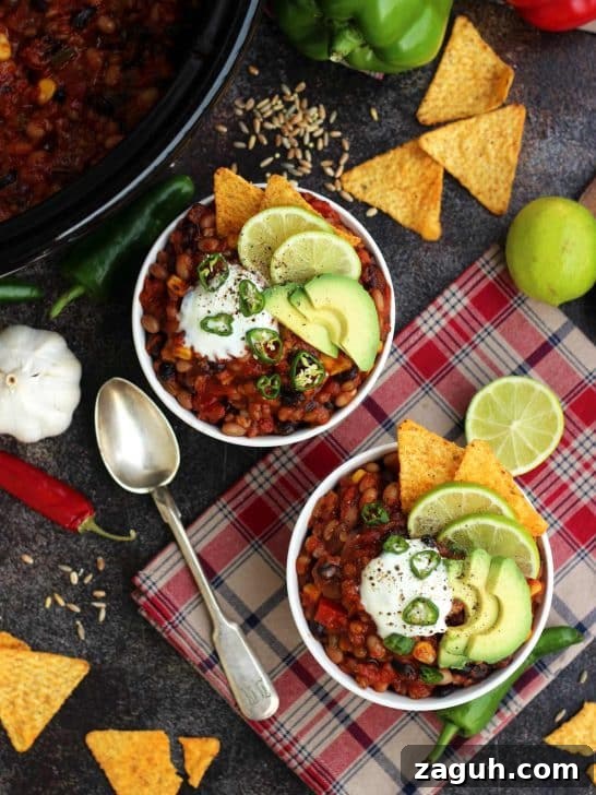 21 Cozy Vegan Comfort Recipes for Every Craving 3 The Best Slow Cooker Vegan Chili Bowls of Chili Flatlay
