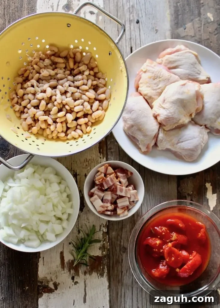 Garlic-Roasted Chicken with Creamy White Beans casserole 3 Ingredients photo, chicken thighs, beans, onion, bacon and stewed tomatoes.