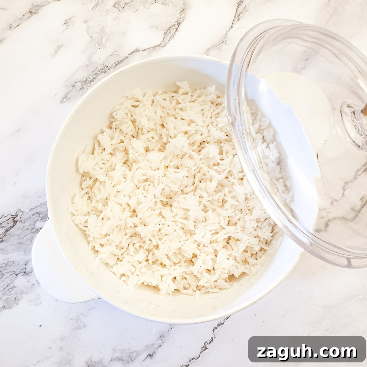 Microwave Rice Guide: Quick, Fluffy Rice in Minutes 5 A pyrex dish filled with rice cooked i the microwave.