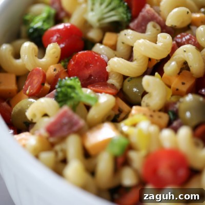 Creamy Italian Pasta Salad with Tangy Herb Vinaigrette 3 pasta salad in a big white bowl.