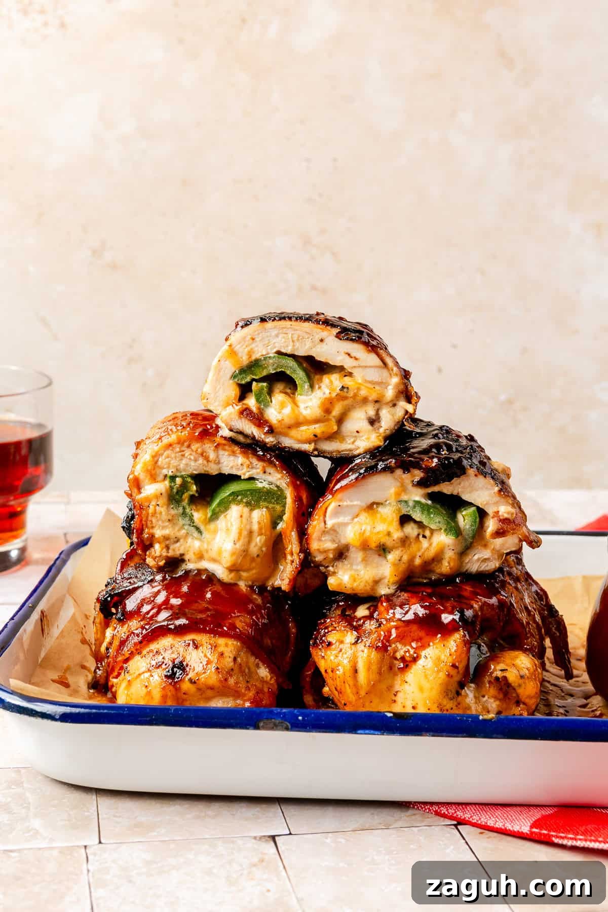 Grilled Jalapeño Popper Chicken stacked on top of one another.